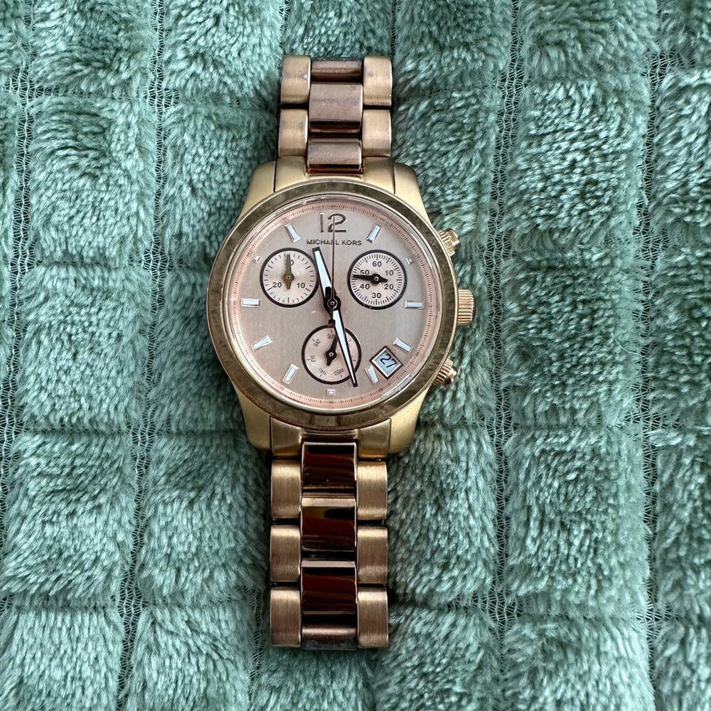 Michael Kors rose gold watch.